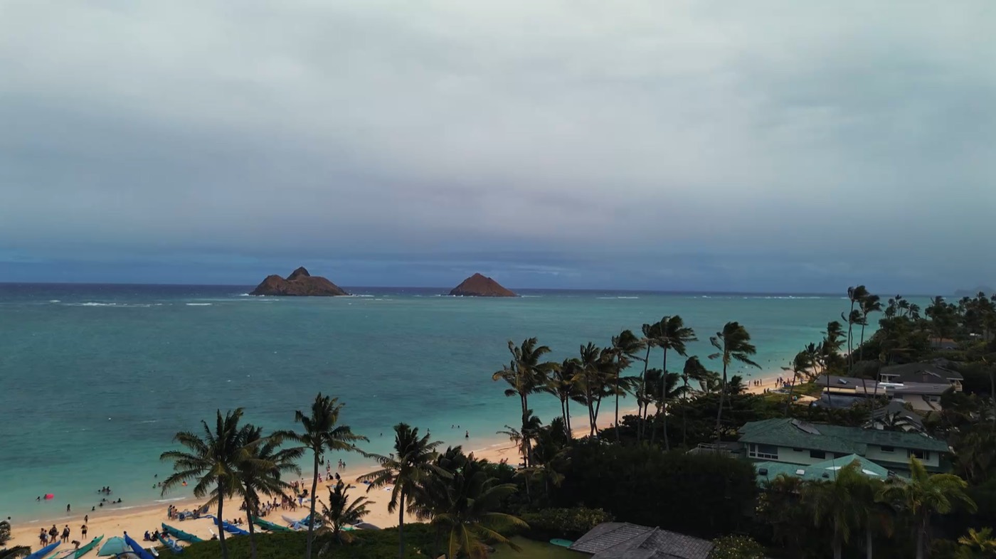 Twin islands off a turquoise beach in Oahu, Hawaii
