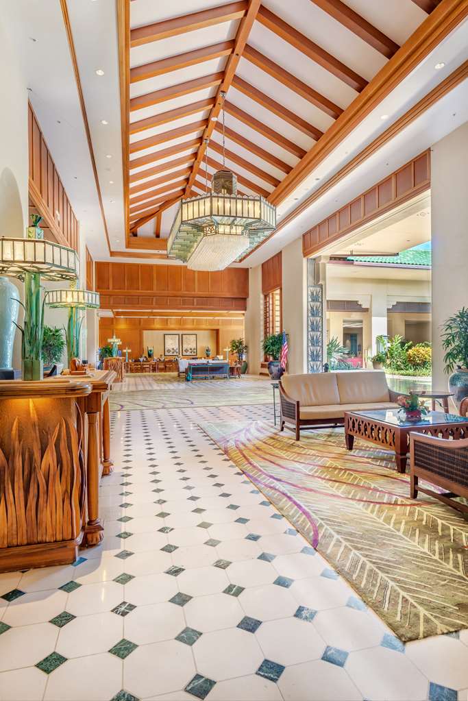 The open-air lobby, framed by the grounds' mature landscaping