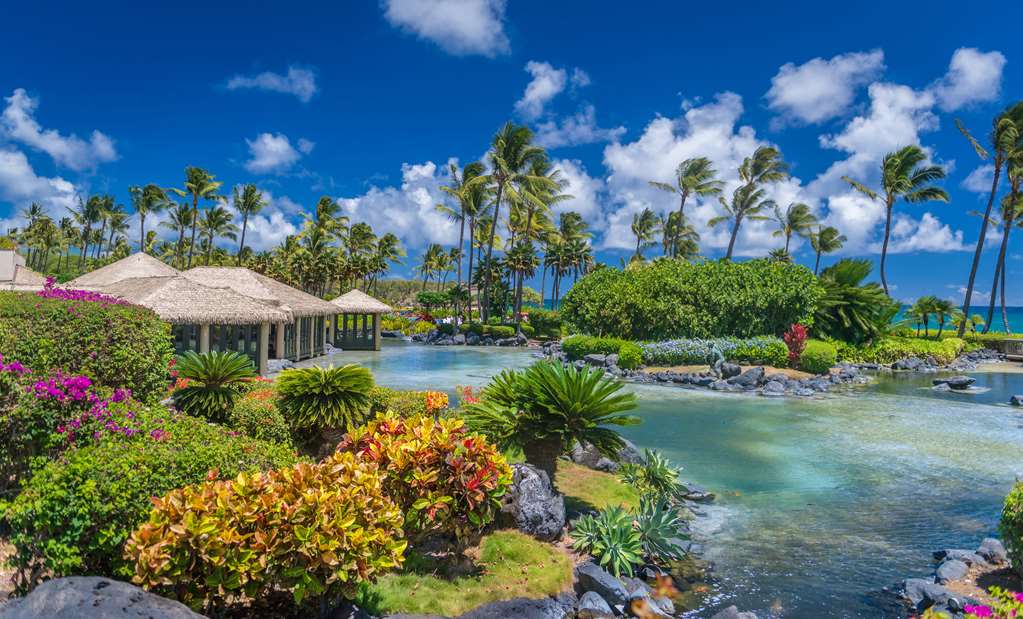 The saltwater lagoon and thatched pavilions at the Grand Hyatt Kauai