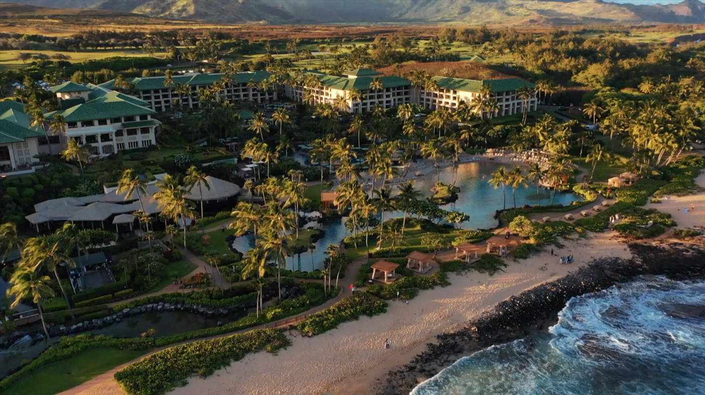 The Grand Hyatt Kauai lagoon and resort grounds at sunset