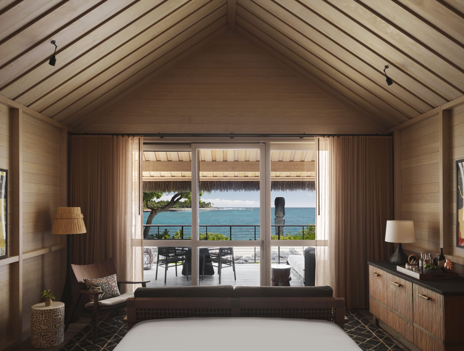 A bedroom opening straight onto the water