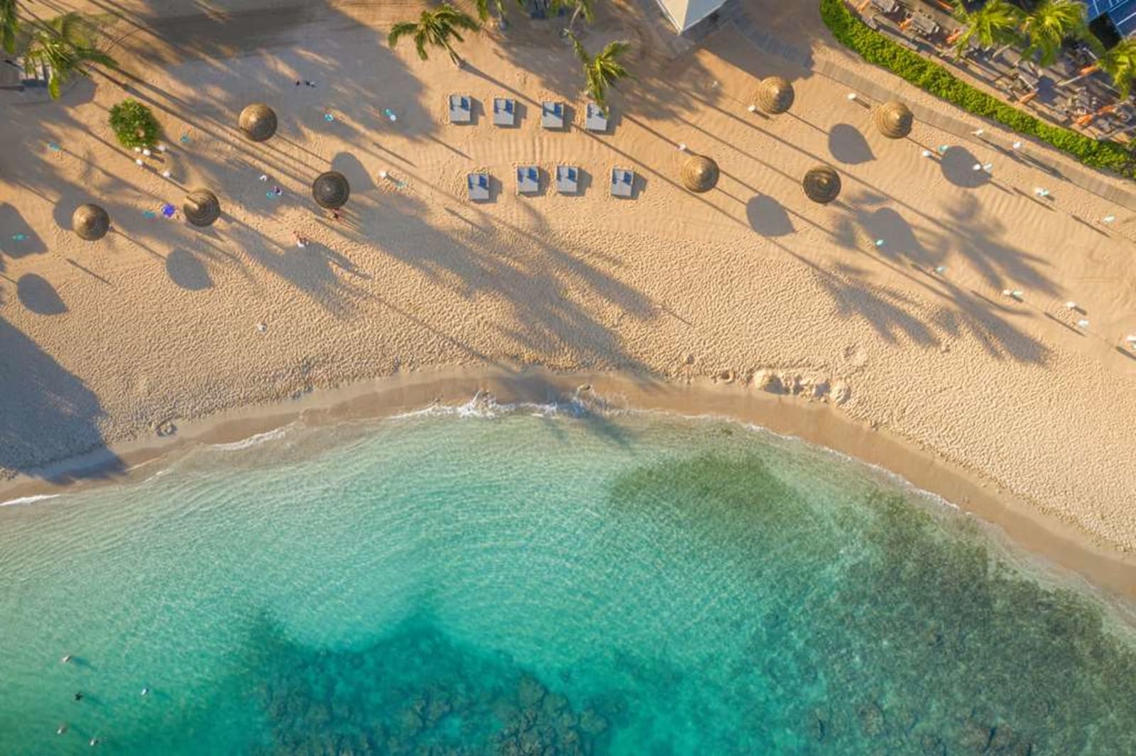 An aerial view of Kuilima Cove, the protected reef-sheltered swimming beach at The Ritz-Carlton O'ahu, Turtle Bay