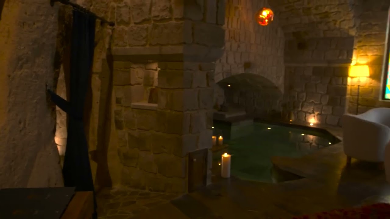 The Mystic cave pool suite at Museum Hotel: a candlelit private pool carved into warm stone